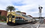 Southbound Sunrail train # P323 approaches the AdventHealth Station in Orlando, enroute from DeLand to Winter Park with Bombardier Bilevel Cab Car/Coach # 2002 on the point 